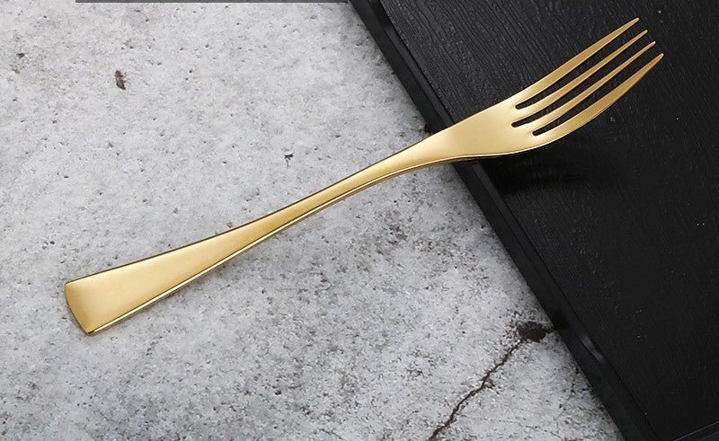 a close up of a spoon and a pair of scissors