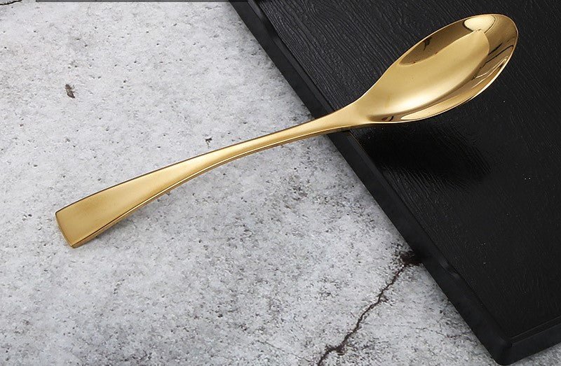 a close up of a spoon and a pair of scissors