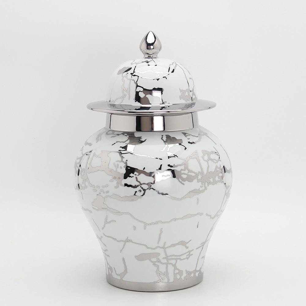 a black and white photo of a white vase