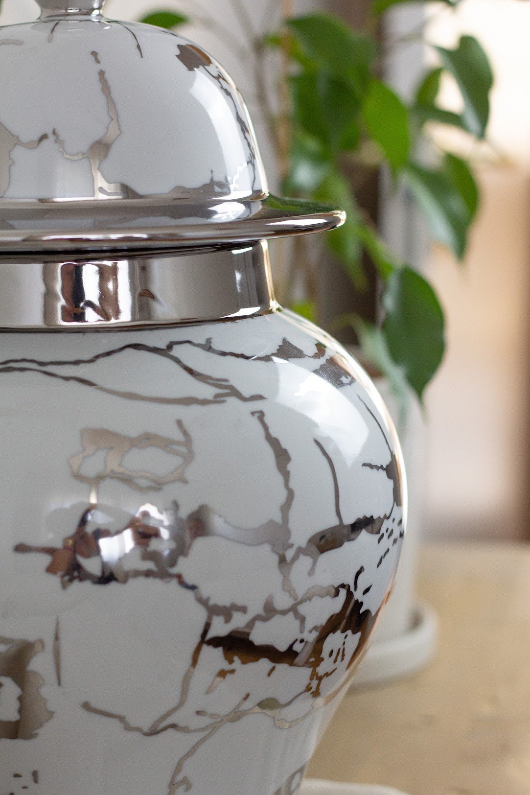 a close up of a vase on a table