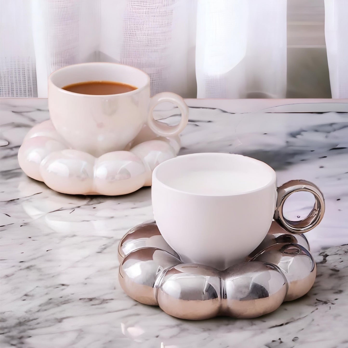 a coffee cup sitting on a table next to a cup of coffee