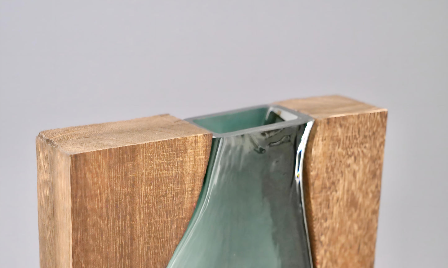 a vase sitting on top of a wooden box