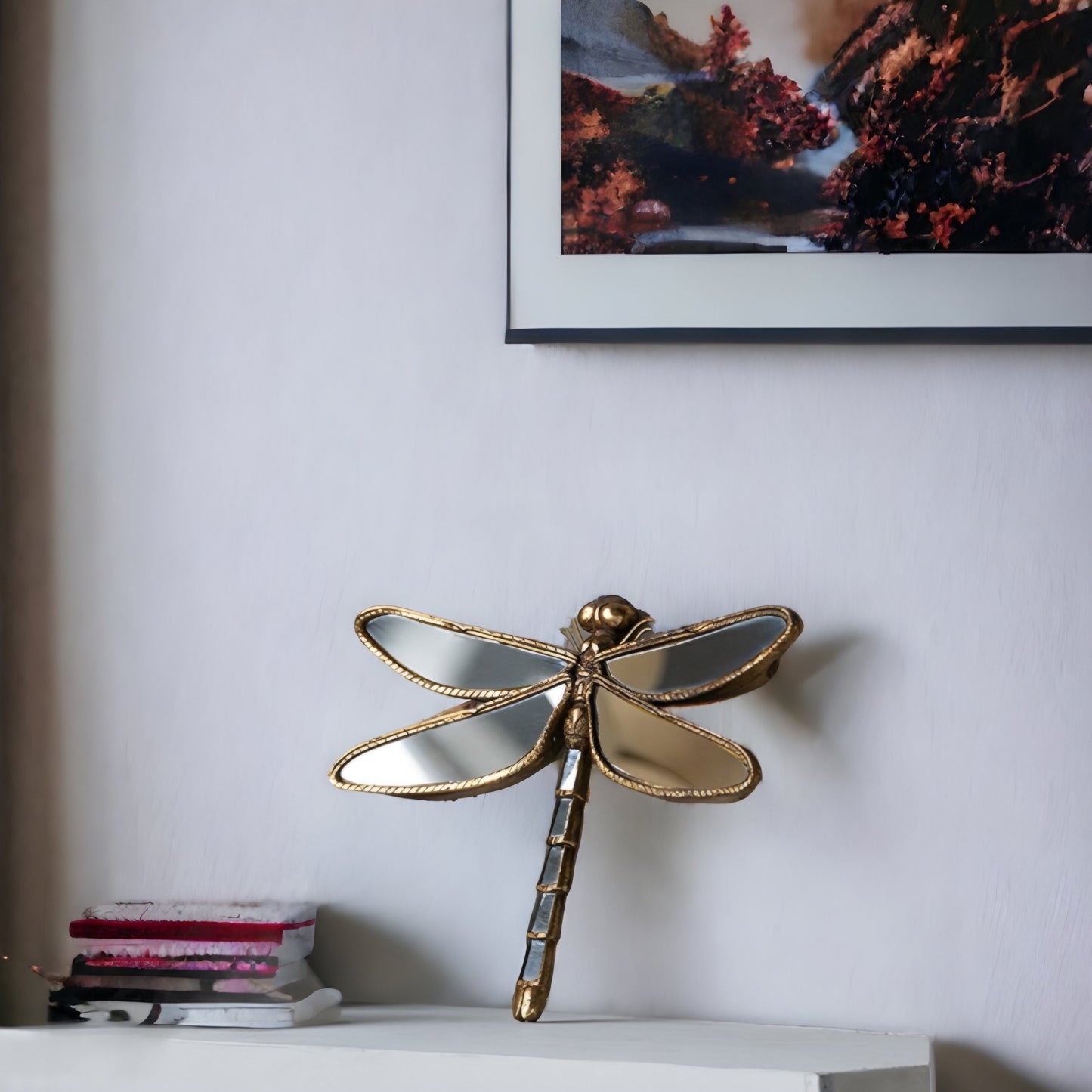 a pair of scissors on a white shelf