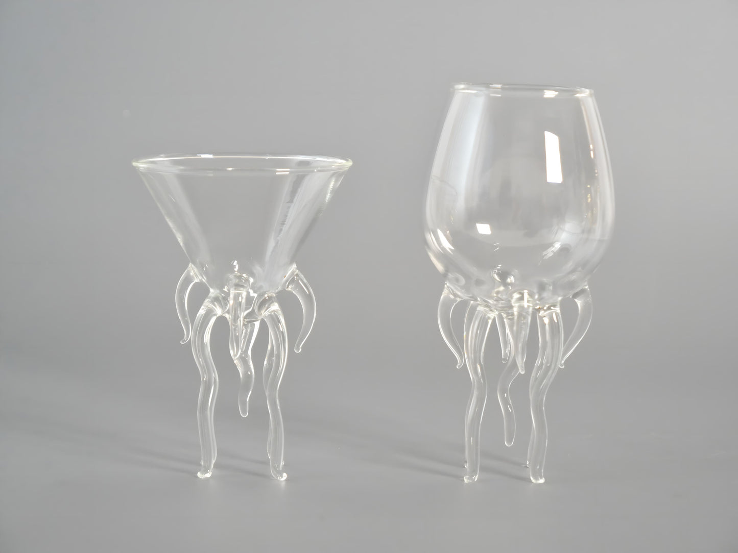 a couple of wine glasses sitting on top of a table