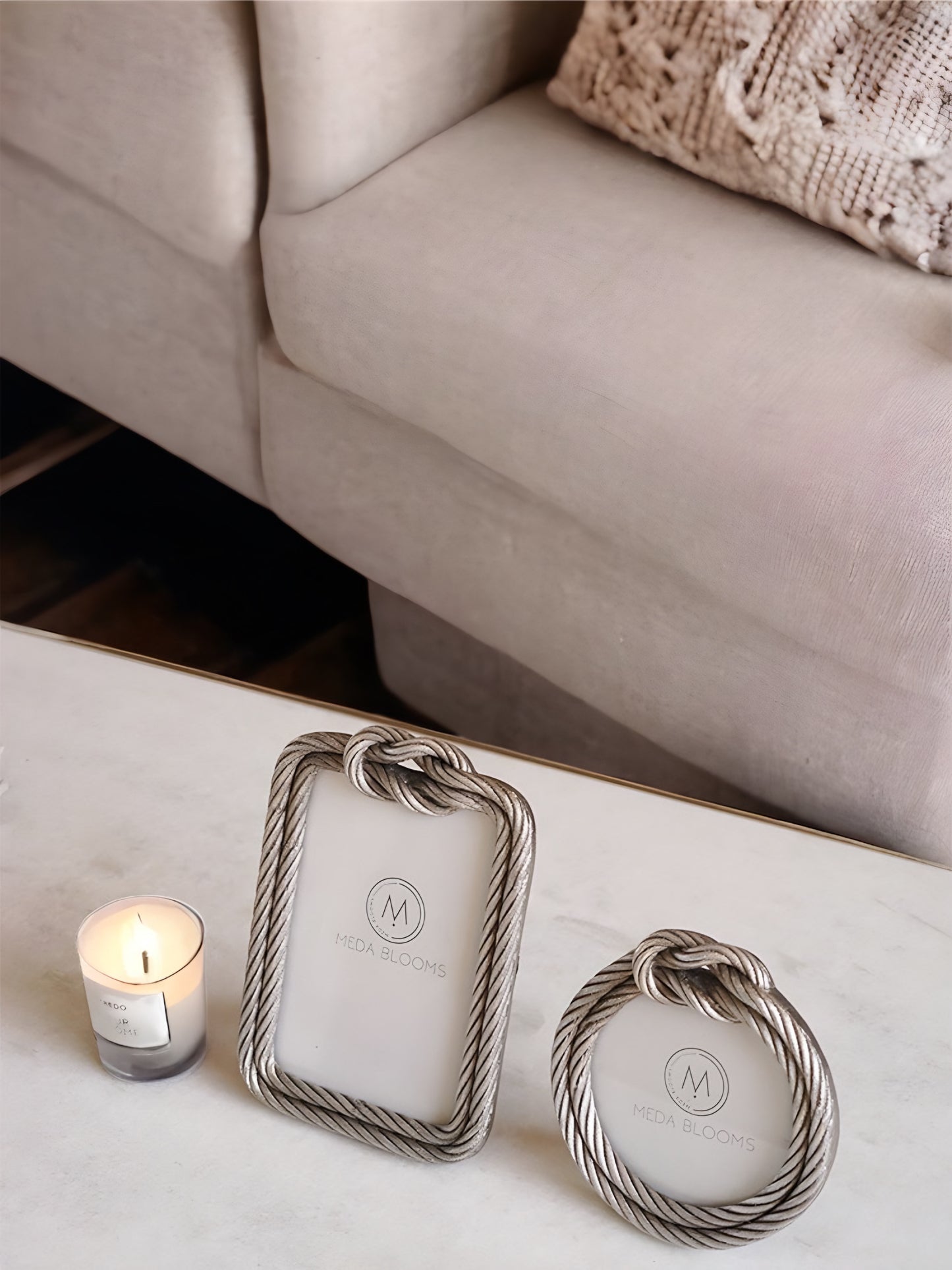 a couple of cell phones sitting on top of a couch