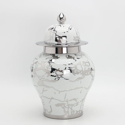 a black and white photo of a white vase 