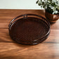 a tennis racquet sitting on top of a wooden table 