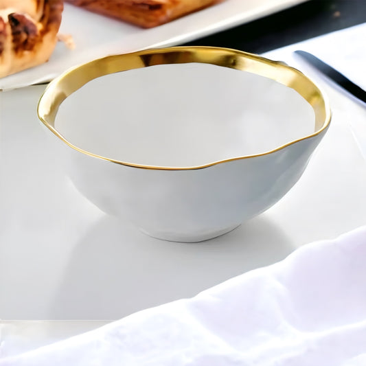 a white bowl with a spoon in it 