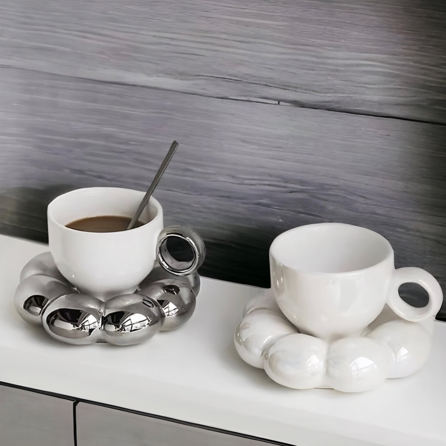 a cup of coffee sitting on top of a table 