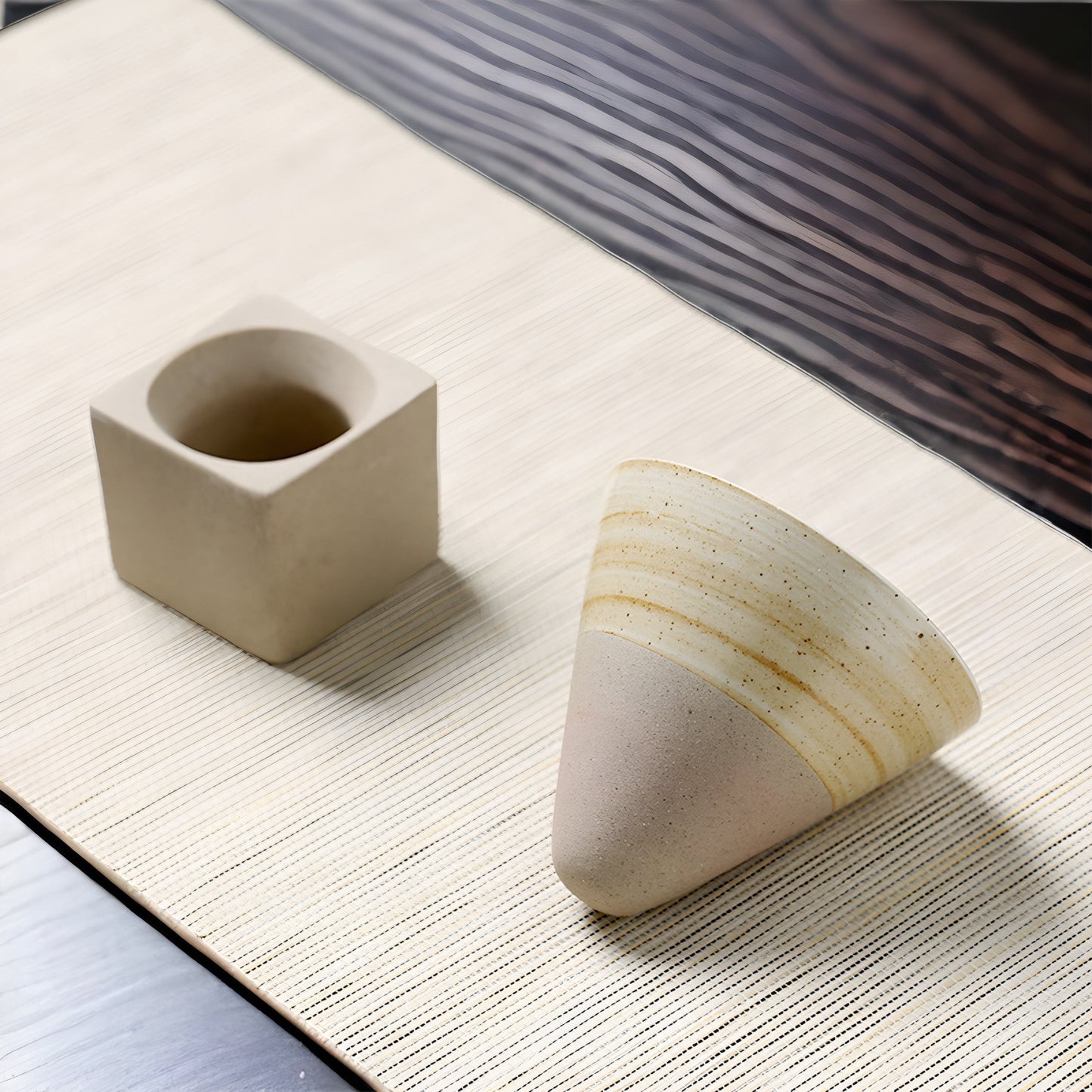 a cup of coffee and a banana sitting on a table 