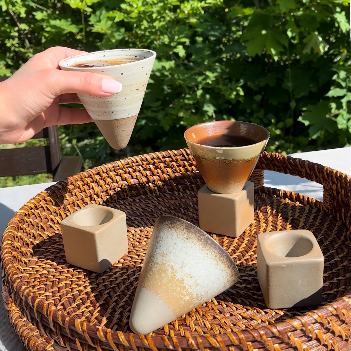 a cup of coffee sitting on top of a table 