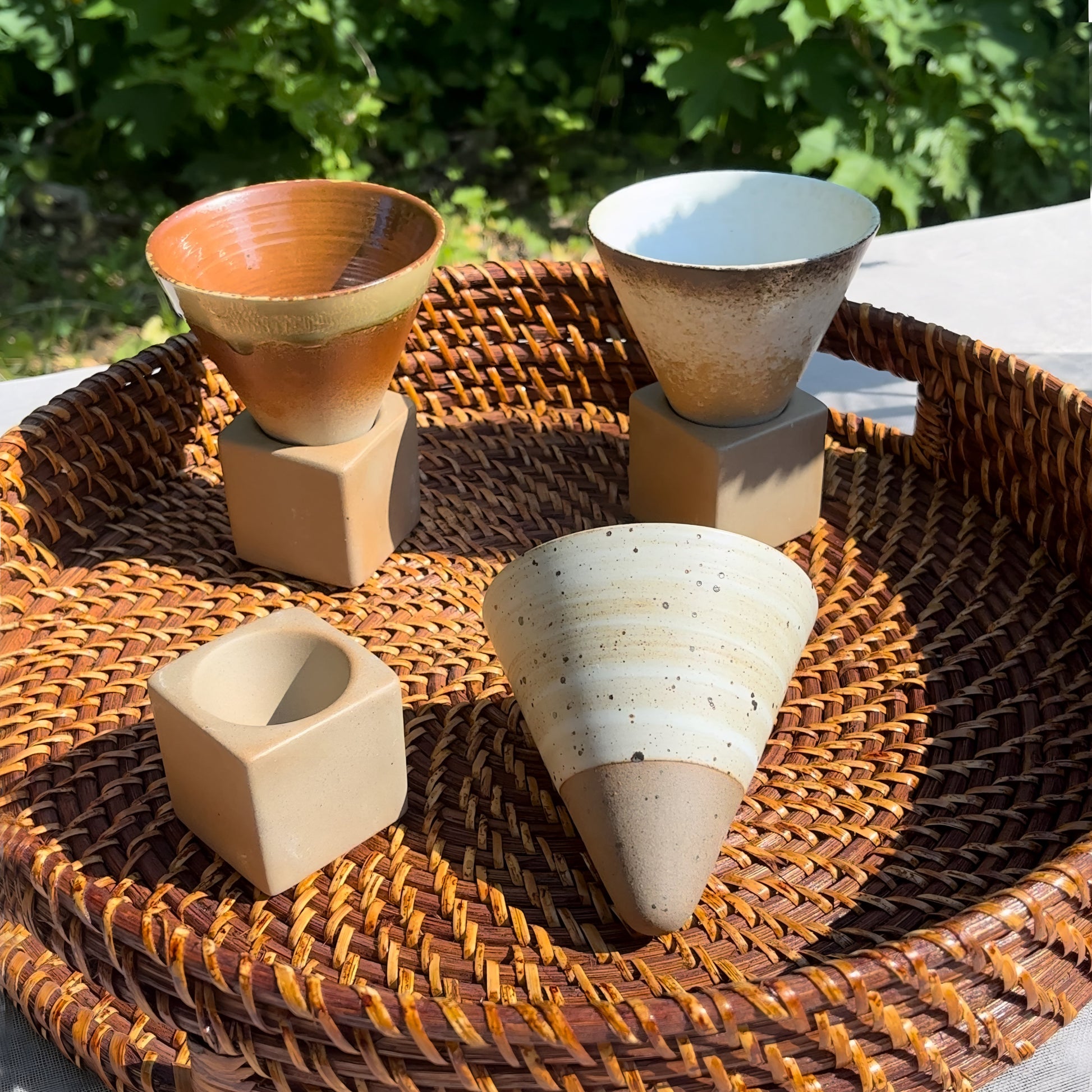 a group of vases sitting on a table 