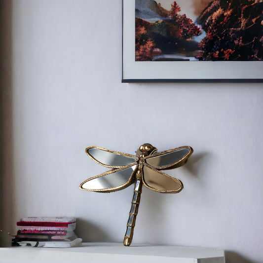 a pair of scissors on a white shelf 