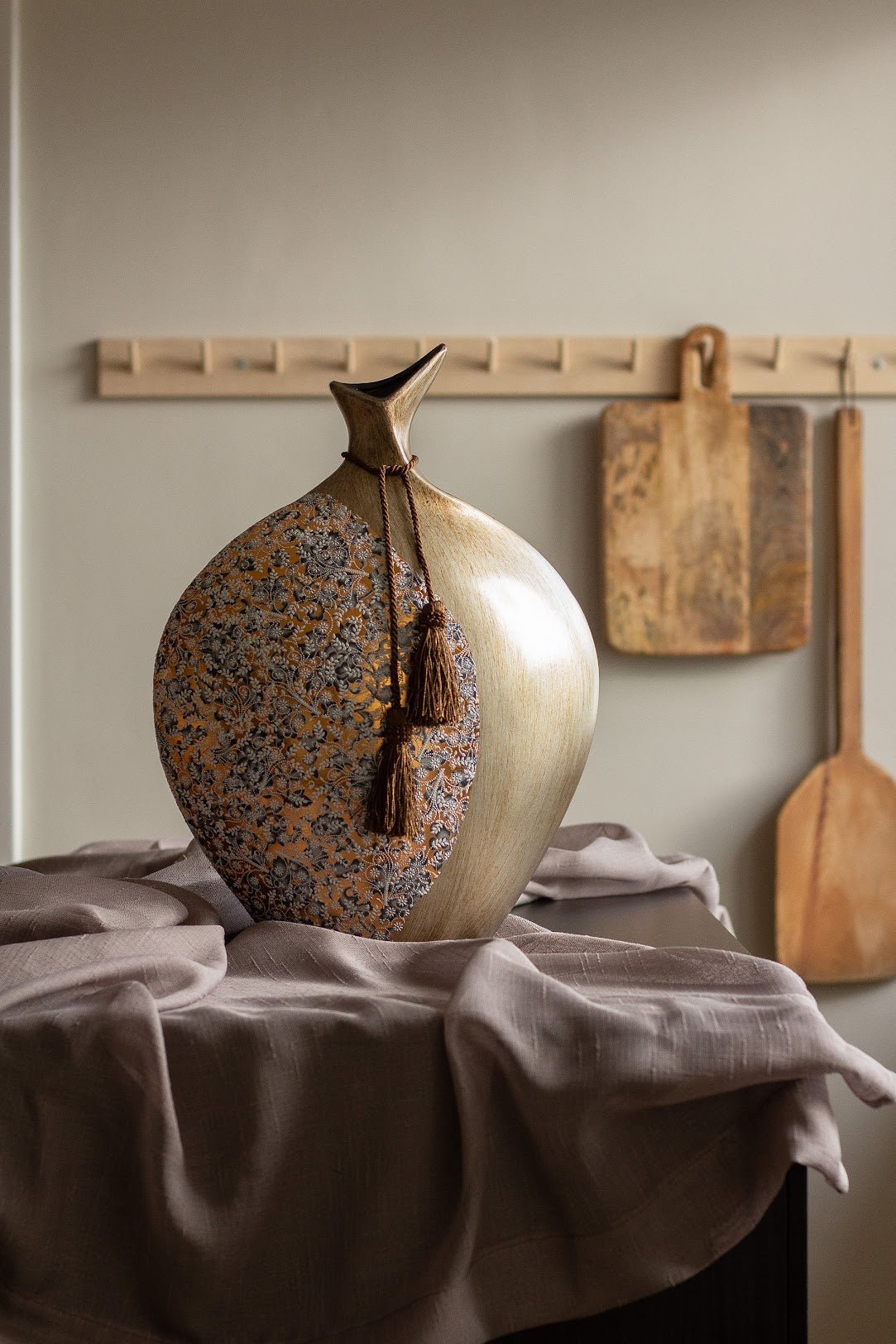 a vase sitting on top of a table 