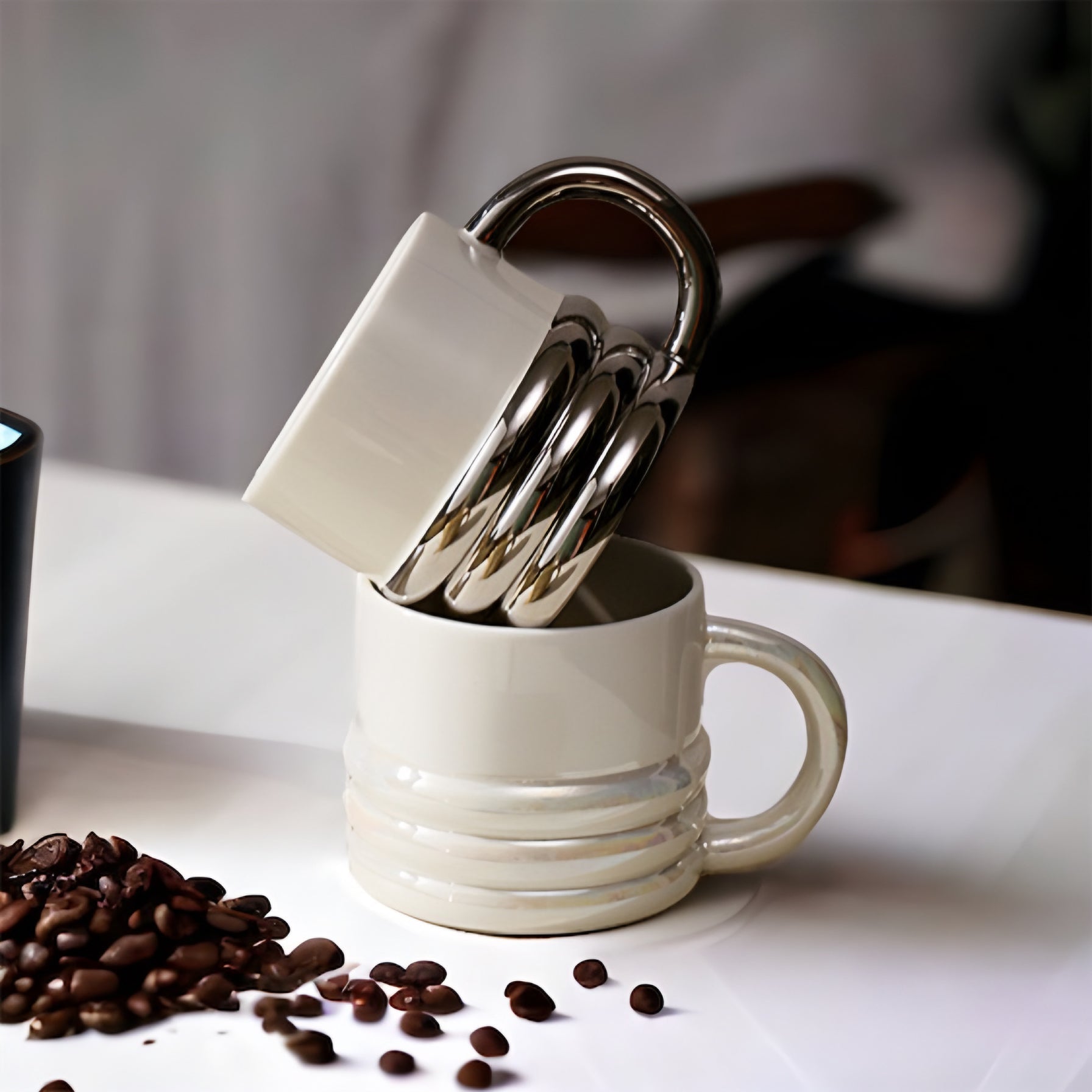 a cup of coffee sitting on top of a table 