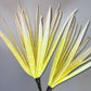 a close up of a yellow flower in a vase 